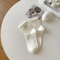 White cotton mid-calf socks featuring elegant ruffle trim and textured wavy patterns - One Size / White