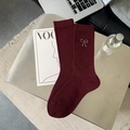 Burgundy ribbed crew socks with silver bow embroidery on a minimalist gray tray - Ancora Red Bow