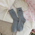 Grey knit mid-calf socks featuring delicate ruffled cuffs and black bow embroidery - Embroidered Bow - Gray