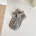 Grey mesh ankle socks featuring pink bow embroidery and white bow patterns - Gray
