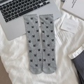 Gray ribbed crew socks with black bow patterns on a clean minimalist background - Gray with Bowknot