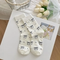 Chic cream white crew socks with black ribbon bows and polka dots on a display tray - Dot Bowknot Style