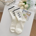White cotton mid-calf socks with black bow embroidery and striped trim design - Black Edge Bowknot Style