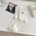 Calcetines blancos de punto acanalado con ribete de volantes y lazo bordado - Talla única / Estilo Liso / Blanco
