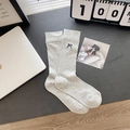 Light gray knit calf socks with dark blue embroidered bow detail and vertical ribbed texture - Grey Bow (Crew)