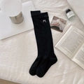 Black knee-high socks featuring white bow embroidery and delicate knit texture - One Size / Calf Socks - Black Bow