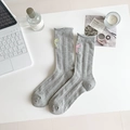 Light gray mid-calf rib socks featuring colorful bow embroidery and wavy rolled cuffs - One Size / Gray