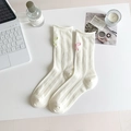Creamy white ribbed mid-tube socks featuring delicate embroidered bows on a flat lay - One Size / Beige
