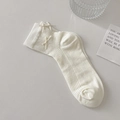 Creamy white ribbed ankle socks featuring double dainty bows and soft mesh cotton texture - Beige