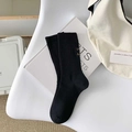 Black mid-calf cotton socks with vertical ribbed texture and small letter embroidery - Black
