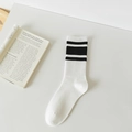 White cotton mid-calf socks with black stripes and ribbed knit texture on white background - One Size / White Medium Stripes