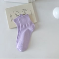Light purple mid-calf cotton crew socks with ribbed cuffs shown on a minimal background - Purple