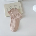 Classic soft pink crew socks with ribbed texture on a minimalist aesthetic background - Brown