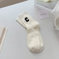 Beige cotton rib-knit crew socks featuring black C letter embroidery in minimalist style - One Size / White
