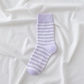 Light purple and white striped crew socks with ribbed cuffs on white cotton fabric - Purple Fine Stripes