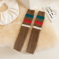 Jambières en fausse fourrure marron avec revers rayés sur un fond en peluche douce - Taille unique / Marron