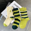 Green striped and floral embroidery cotton crew socks set for women displayed on white books - Green Series Mixed (3 Pairs)