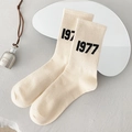 Beige crew socks with black 1977 text and elastic ribbed cuffs for women - One Size / Beige 1997