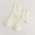Minimalist solid white cotton crew socks with ribbed cuffs and soft texture - Beige