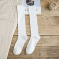 Classic white ribbed knee-high socks for women in soft cotton knit style - White