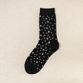 Thick black wool crew socks with white star patterns and ribbed cuffs for warmth - One Size / Star