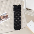 Women's black mesh ruffled crew socks with vintage diamond knit pattern on a chair - One Size / Black Lattice Coin