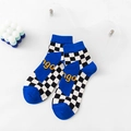 Blue mid-calf socks with checkerboard pattern and orange ngo lettering accents - Blue Black White Checkerboard Letter (NGO)