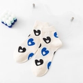 Mid-calf cotton socks in cream white with blue and black heart patterns and ribbed cuffs - Beige Heart Pattern