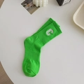 Bright green cotton crew socks featuring white C letter embroidery and ribbed texture - Bright Green