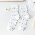 White cotton mid-calf socks with blue flower patterns and ruffled edges for women - Allover Small Flowers
