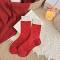Thick red wool socks with white polka dots and lace bow detail in a cozy winter setting - Red with White Polka Dots