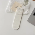 Elegant white ballet style crew socks with ruffle trim and vertical ribbed knit texture - White