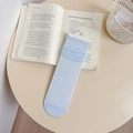Light blue slouch socks with vertical ribbed texture and bow design for women - Blue