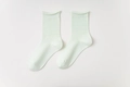 Weiche mintgrüne Baumwollsocken mit minimalistischem Rollrand und feiner Rippstruktur - Einheitsgröße / Hellgrün