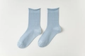 Light blue mid-calf cotton socks featuring vertical rib knitting and casual roll top edges - One Size / Light Blue