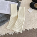 Creamy white ribbed knit leg warmers in a cozy aesthetic lifestyle setting - White