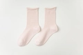 Light pink mid-calf cotton socks featuring vertical ribbed texture and rolled cuffs - One Size / Light Pink