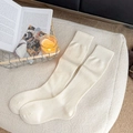 Cozy cream white knit wool calf socks featuring ribbed elastic cuffs and warm texture - One Size / White