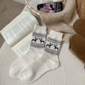 Fair Isle winter wool socks featuring brown reindeer jacquard on white knit fabric - One Size / White