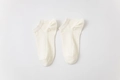 Off-white low cut cotton socks with breathable mesh texture and ribbed cuffs - White