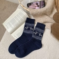 Dark blue winter wool socks featuring white reindeer and snowflake Nordic knit patterns - One Size / Navy Blue