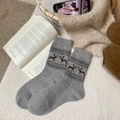 Gray Fair Isle wool socks featuring brown reindeer patterns and Nordic jacquard knits - One Size / Light Gray