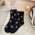 Black mid-calf socks with white floral knit patterns and ruffled cuff details - One Size / Black