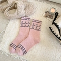 Pink Fair Isle wool socks with floral knit patterns for women in cozy home setting - One Size / Pink