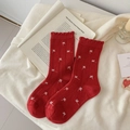 Calze rosse con motivi a fiori bianchi e un elegante bordo a volant per donne - Tutto Floreale