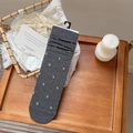 Dark gray knitted mid-calf socks with white floral embroidery and elastic ribbed cuffs - Dark Gray
