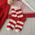 Red and white striped knit wool socks for New Year with thick warm coral fleece texture - Bold Striped