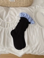 Contrast ruffled crew socks in black featuring blue stripes and polka dot accents - Black