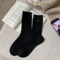 Classic black ribbed wool crew socks with elegant silver metal detail for winter - Black