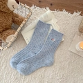 Light blue speckled wool knit socks with cute cat embroidery in a cozy home setting - One Size / Light Blue
